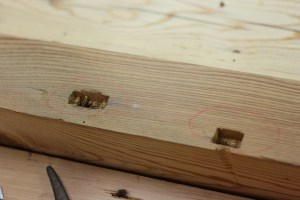 Enlarged mortise and dent on the left; initial mortise on the right.
